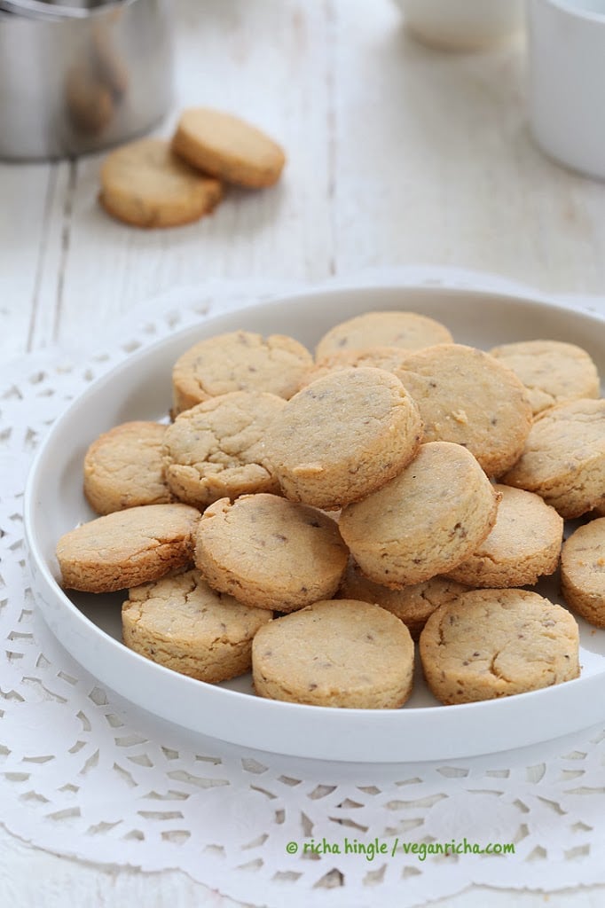 vegan sugar cookies  vegan sugar cookies on a white cookie plate