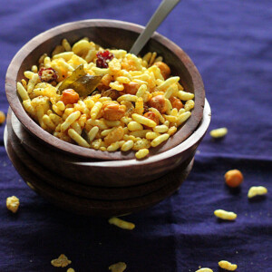 Chivda served in a small bowl on a dark work surface