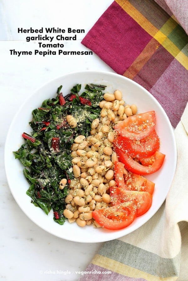 This Herbed White Bean Chard bowl is full of amazing flavors from fresh herbs. Thyme pepita parmesan adds the crunchy cheesy topping. Vegan Gluten-free Clean eating