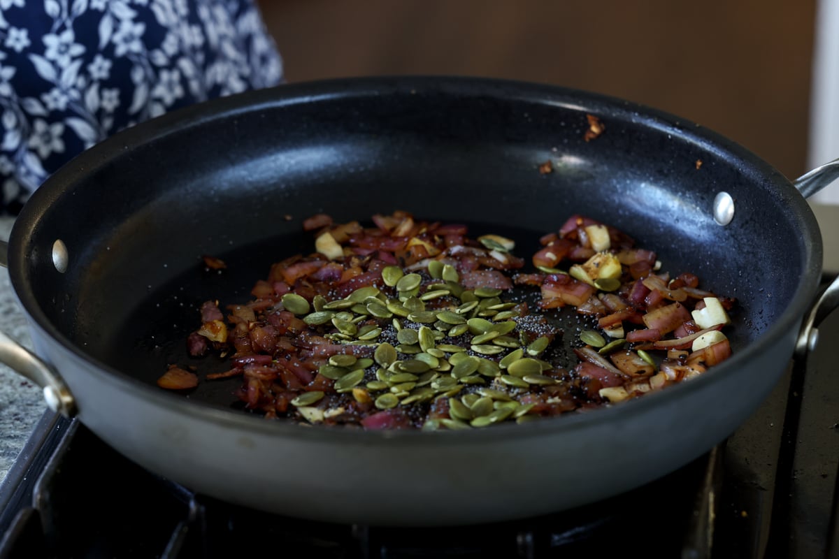 adding seeds to the pan