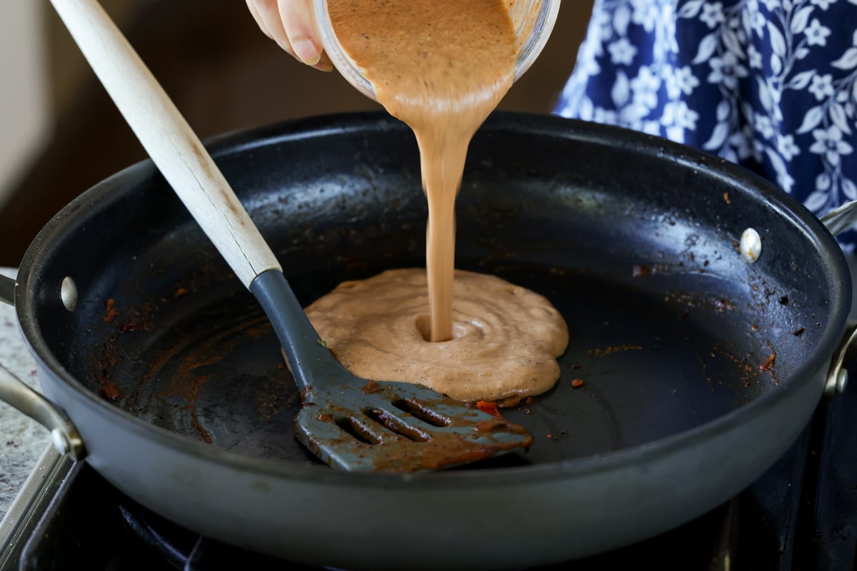 adding blended sauce back to the pan