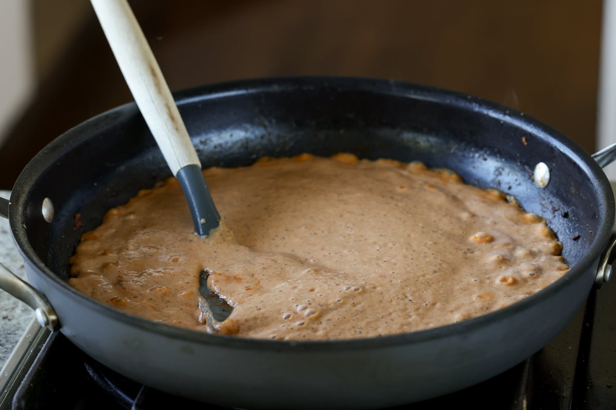 bringing the sauce to a boil