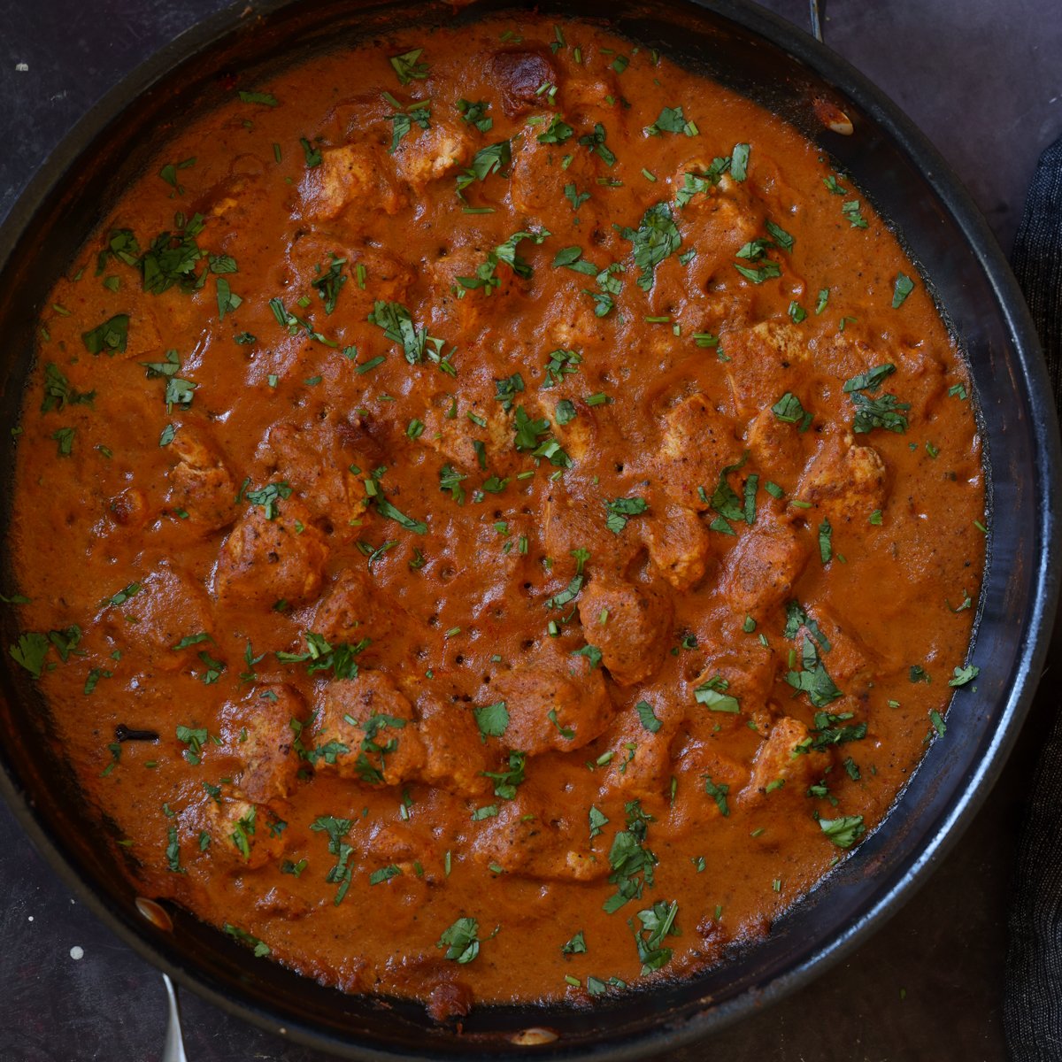 tofu Pasanda in the pan with cilantro garnish