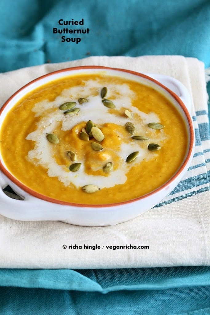 Vegan Curried Butternut Squash Soup with a dash of garam masala and garnished with cinnamony toasted coconut and pepitas | VeganRicha.com #vegan #glutenfree #soyfree #nutfree #soup