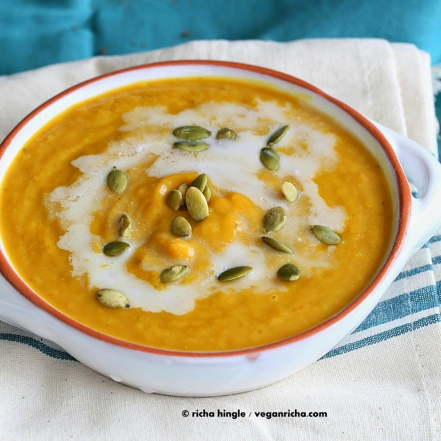 Vegan Curried Butternut Squash Soup with a dash of garam masala and garnished with cinnamony toasted coconut and pepitas | VeganRicha.com #vegan #glutenfree #soyfree #nutfree #soup