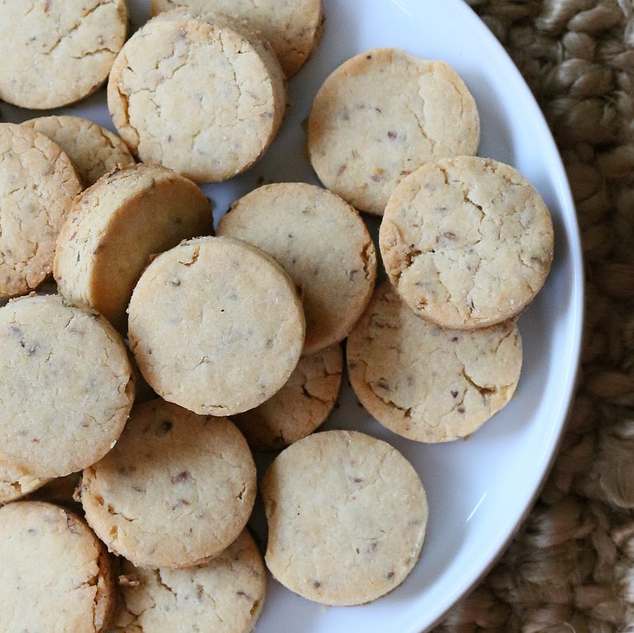 vegan sugar cookies overhead shot of gluten-free vegan sugar cookies on a white cookie platter