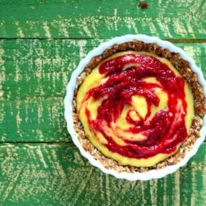 Top down shot of a beet cream pie on a green back ground