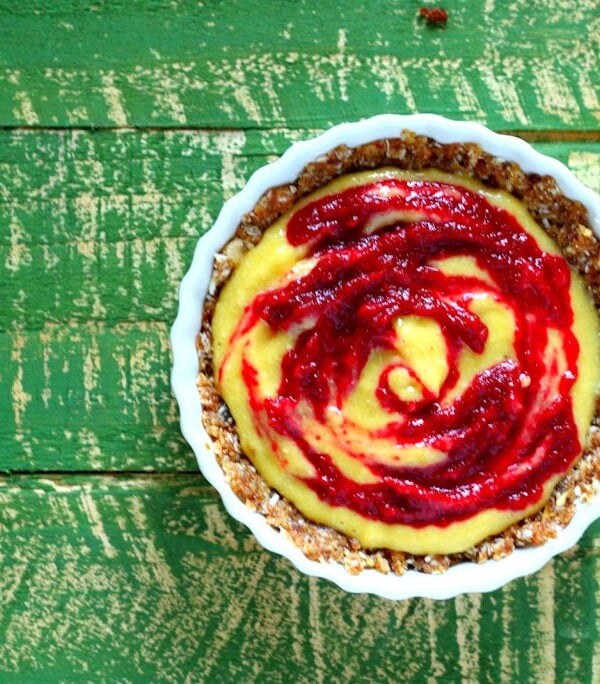 Top down shot of a beet cream pie on a green back ground