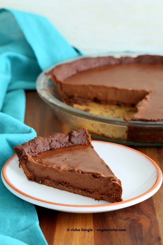 Vegan Chocolate Silk Pie is filled with smooth Dark chocolate filling, & a Almond Chocolate Crust. topped with cashew cream. Gluten-free Soy-free | VeganRicha.com