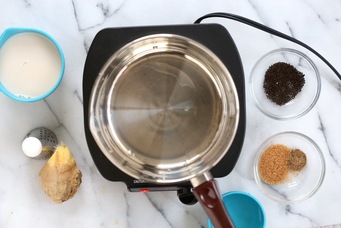 Vegan Indian Masala Chai. Fabulous almond milk tea with fresh ginger and homemade chai spice blend with cardamom, cinnamon, pepper. Flavorful traditional Indian Chai made vegan