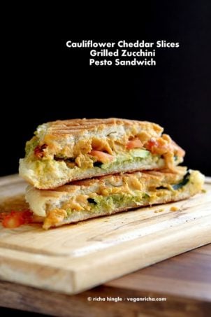 Cauliflower Cheddar, pesto, Grilled zucchini Sandwich on a wood board #VeganRicha