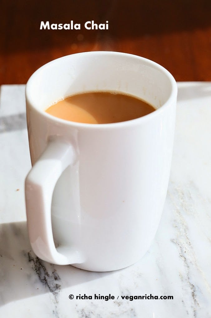 Vegan Indian Masala Chai. Fabulous almond milk tea with fresh ginger and homemade chai spice blend with cardamom, cinnamon, pepper. Flavorful traditional Indian Chai made vegan #veganricha