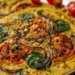 chickpea omelette prepared with the veggies inside