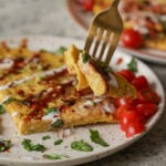 fork taking a bite of a vegan omelet