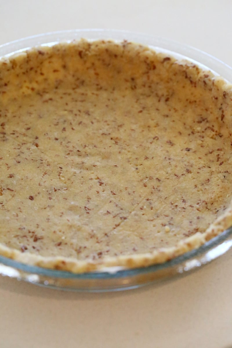 almond flour pie crust a healthy vegan almond flour pie crust in a Pyrex pie dish ready for baking