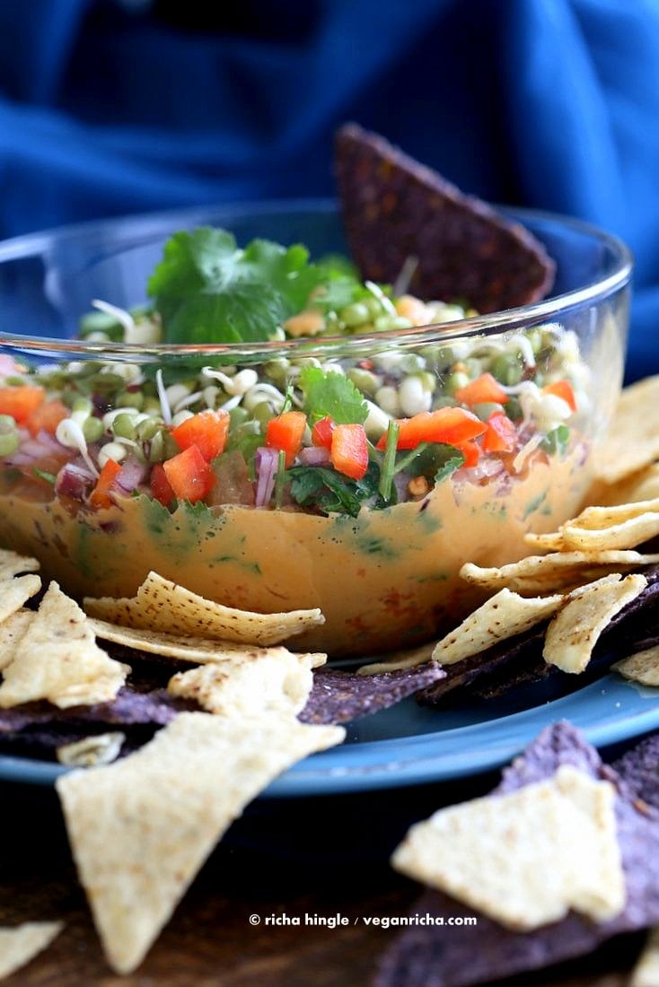 This Thai layered Dip has carrots, Peanut butter sauce, spicy salsa, cilantro, sprouts, & peanuts. all layered up for the perfect appetizer. #Vegan #Glutenfree #Recipe #VeganRicha | Vegan Richa