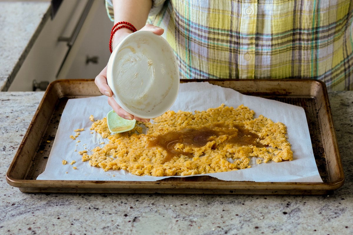 adding maple syrup mixture to the red lentils