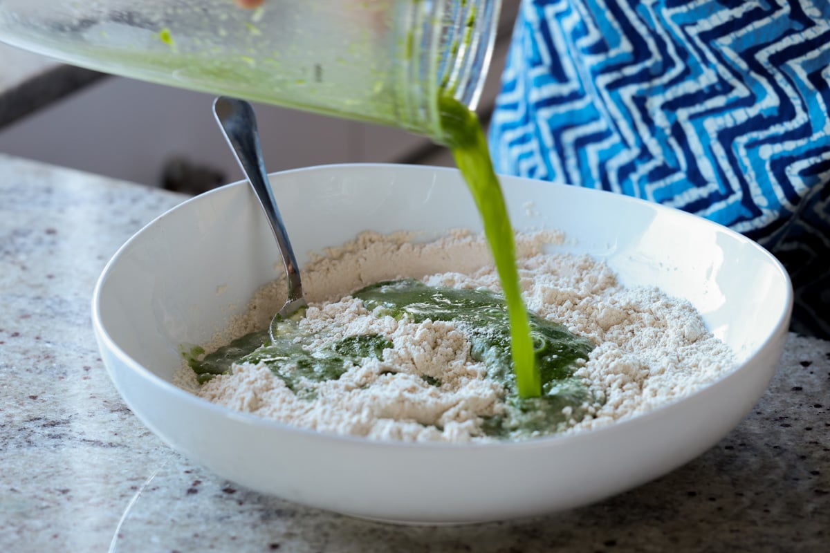 adding the spinach mixture to the dry ingredients
