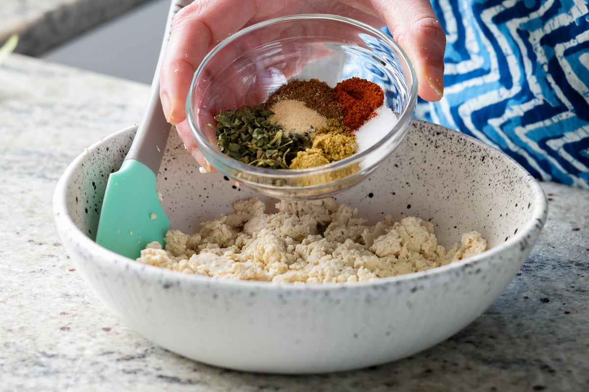 adding ground spices to the tofu