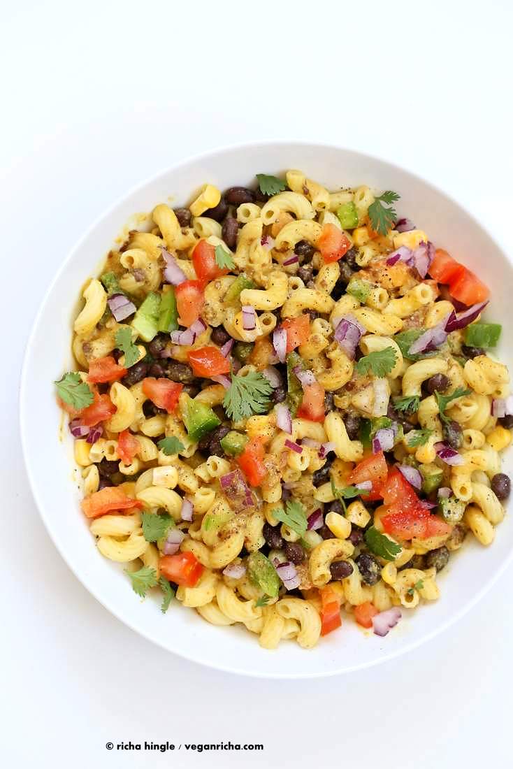 Our vegan southwestern pasta salad with black bean dressing in a white bowl