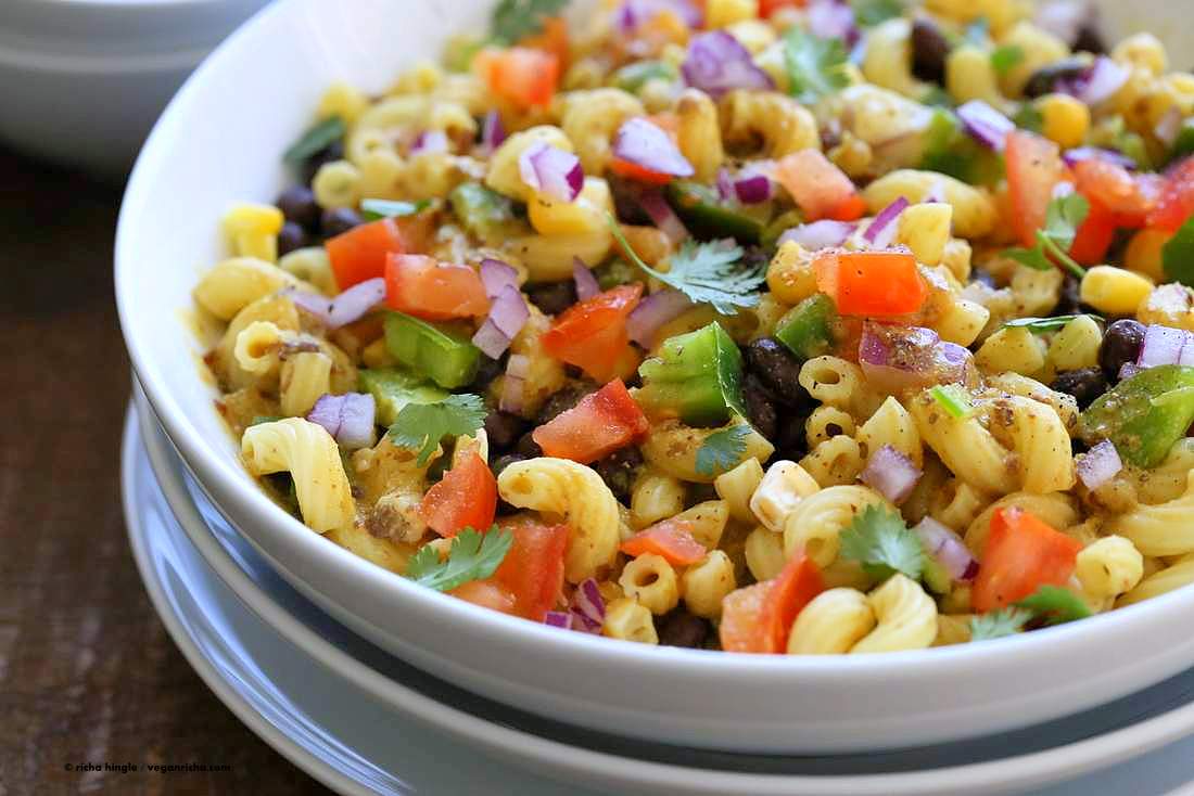 Our vegan southwestern pasta salad with black bean dressing in a white bowl