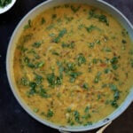 dal fry in the pan garnished with more cilantro