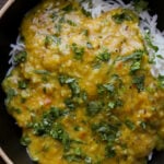dal fry in a bowl over rice