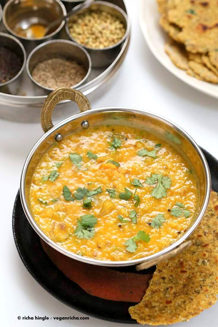 dal fry served with a papadum on the side