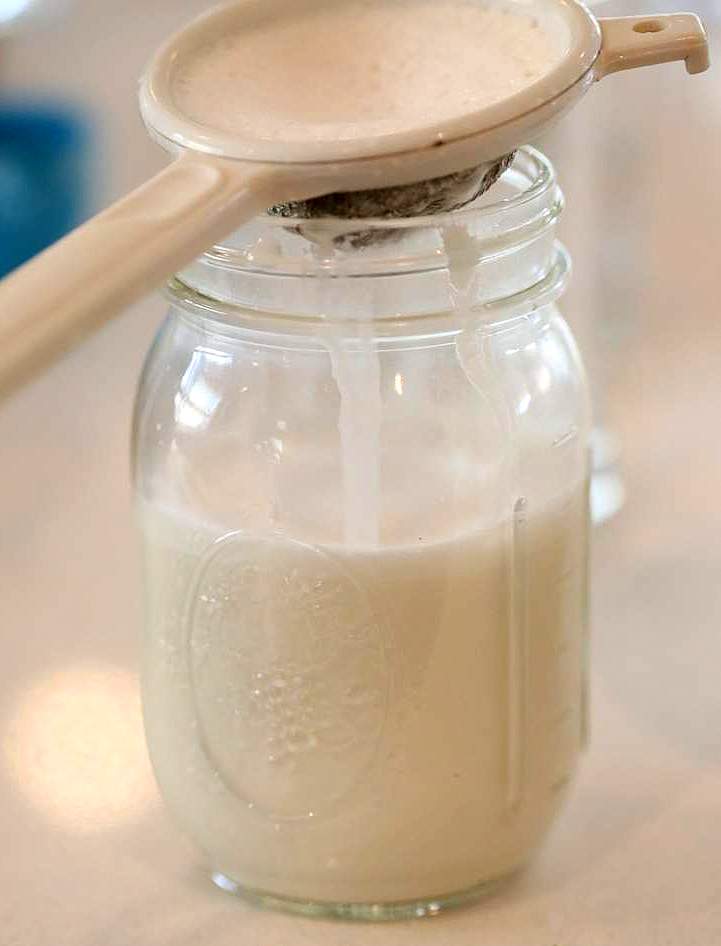 How to make Almond Milk with raw almonds or blanched almonds. Blanched almond milk has a less prominent flavor which works great for Indian Chai| Vegan Richa