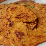 torn sweet potato flatbread on a serving plate, so you can see the texture even more