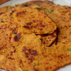 torn sweet potato flatbread on a serving plate, so you can see the texture even more