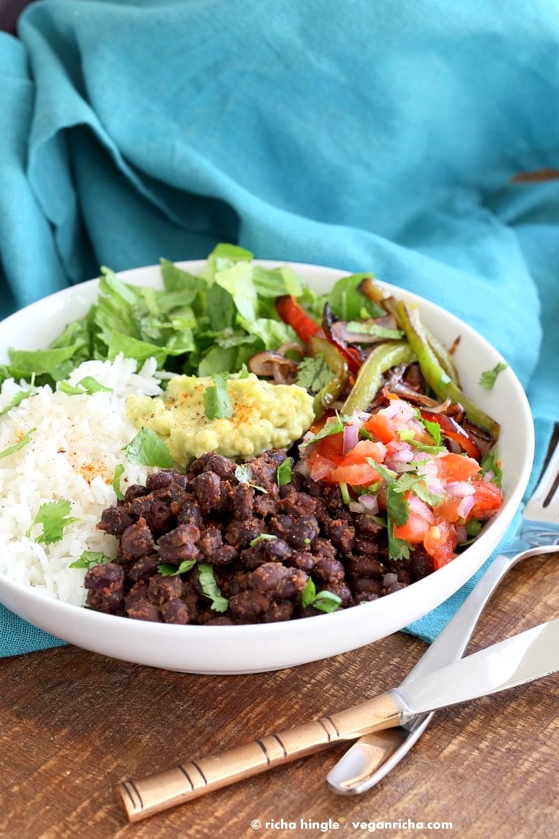Easy Burrito Bowl. Spicy black beans, roasted peppers and veggies, zesty guacamole, pico de gallo, fresh lettuce. DIY Burrito Bowl Chipotle style. | VeganRicha.com #vegan #glutenfree #soyfree #bowl #recipe