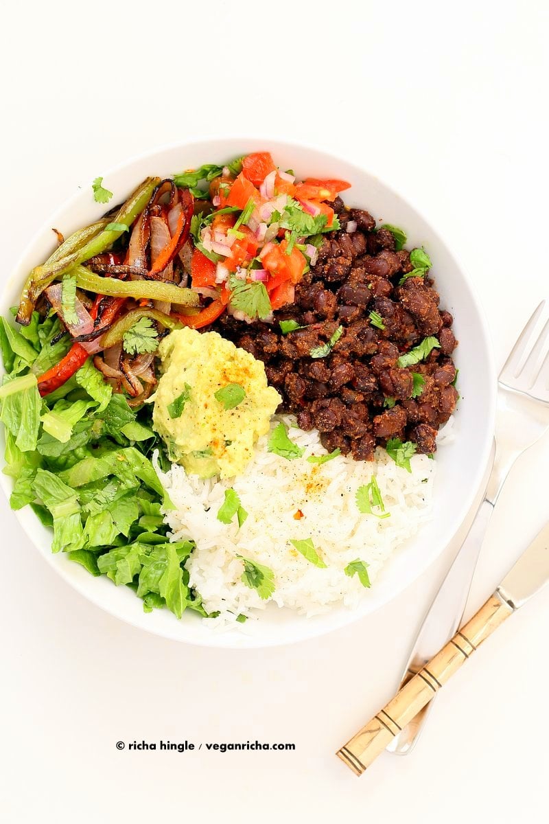 Easy Black Bean Burrito Bowl. Spicy black beans, roasted peppers and veggies, zesty guacamole, pico de gallo, fresh lettuce. DIY Burrito Bowl Chipotle style. | VeganRicha.com #vegan #glutenfree #soyfree #bowl #recipe