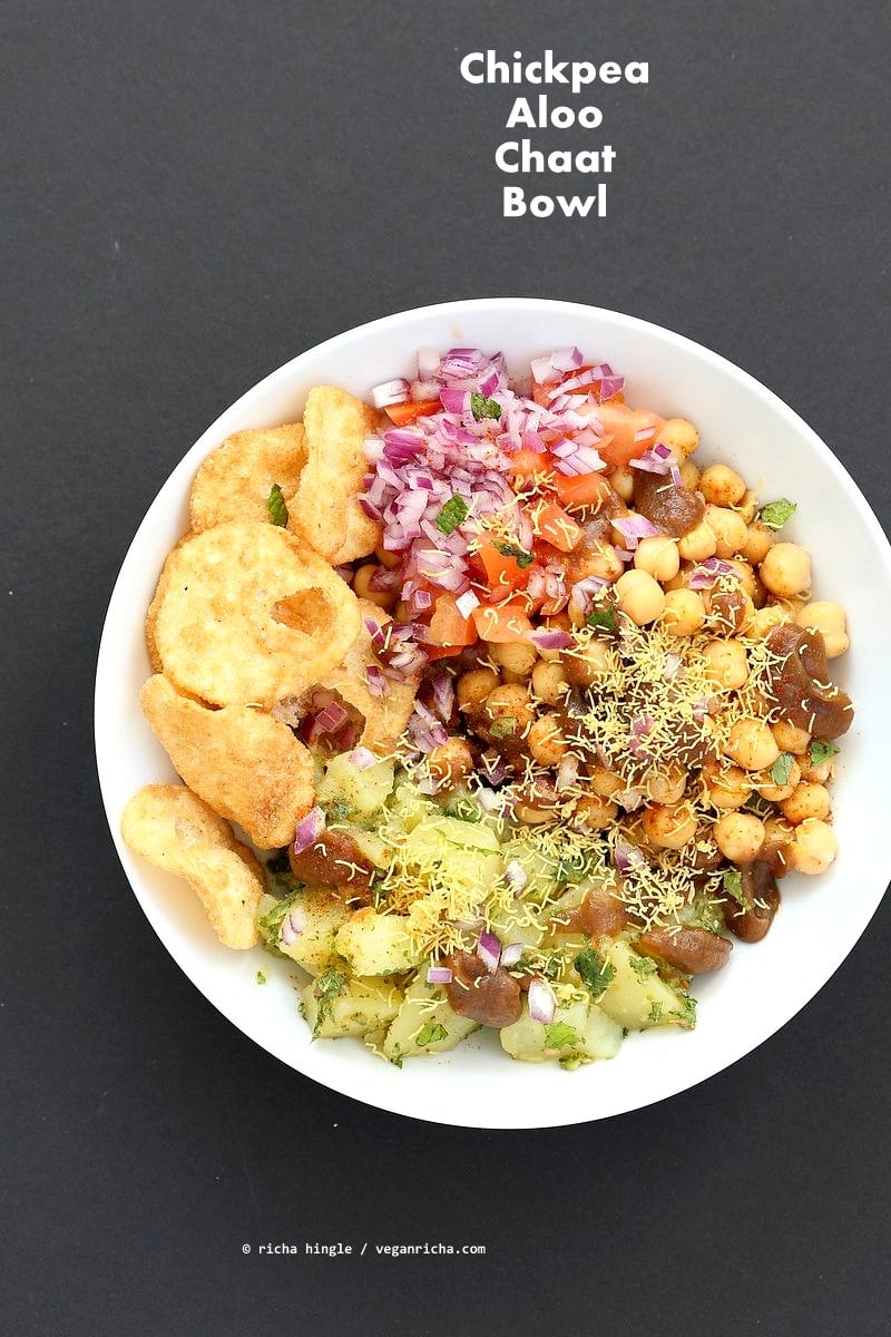 Chickpea Aloo Chaat Bowl. Mint cilantro Potatoes, spiced chickpeas, tamarind date chutney bowl with onions, tomatoes and chaat masala. | VeganRicha.com #vegan #glutenfree #bowl #recipe