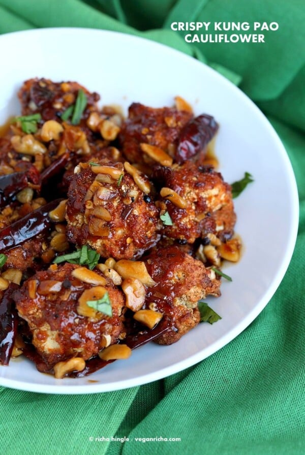 Crispy Kung Pao Cauliflower. Cauliflower battered and baked and tossed in spicy kung pao sauce. | VeganRicha.com #vegan #appetizer #snack #cauliflower #kungpao #recipe #veganricha