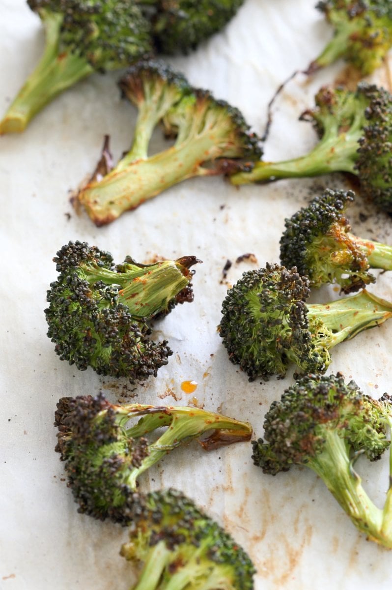 Roasted Broccoli with Creamy Basil Dressing. Broccoli tossed in garlic, cayenne, and baked. Served with cheesy cashew basil sauce. Vegan Gluten-free soy-free Recipe | VeganRicha.com