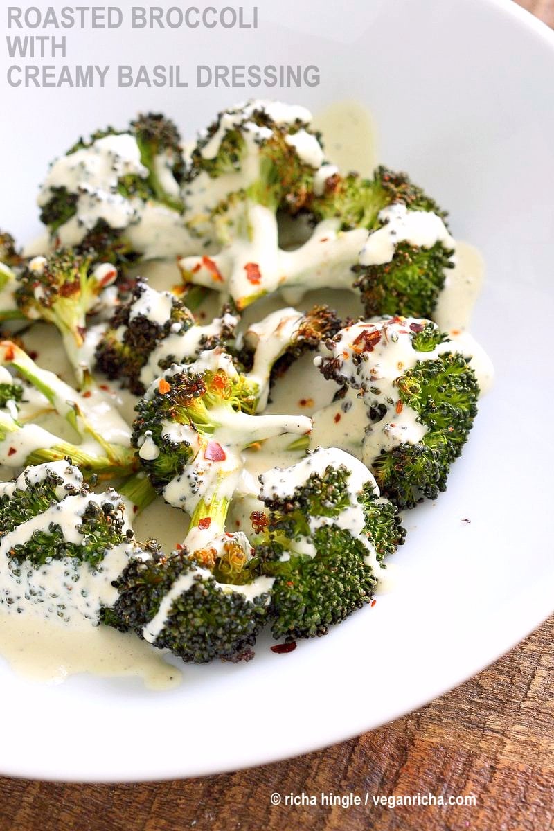 Roasted Broccoli with Creamy Basil Dressing. Broccoli tossed in garlic, cayenne, and baked. Served with cheesy cashew basil sauce. Vegan Gluten-free soy-free Recipe | VeganRicha.com