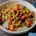 cashew tofu stir fry in a bowl with rice