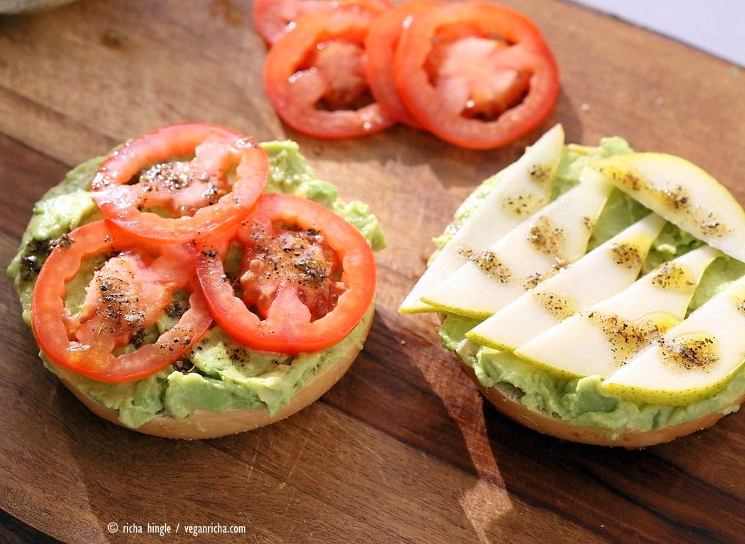 Avocado Bagels with Pears and Tomatoes and Mediterranean Oregano Garlic Olive Oil Dressing Bagel Avocado Toast. Easy Vegan Snack or Breakfast. | VeganRicha.com