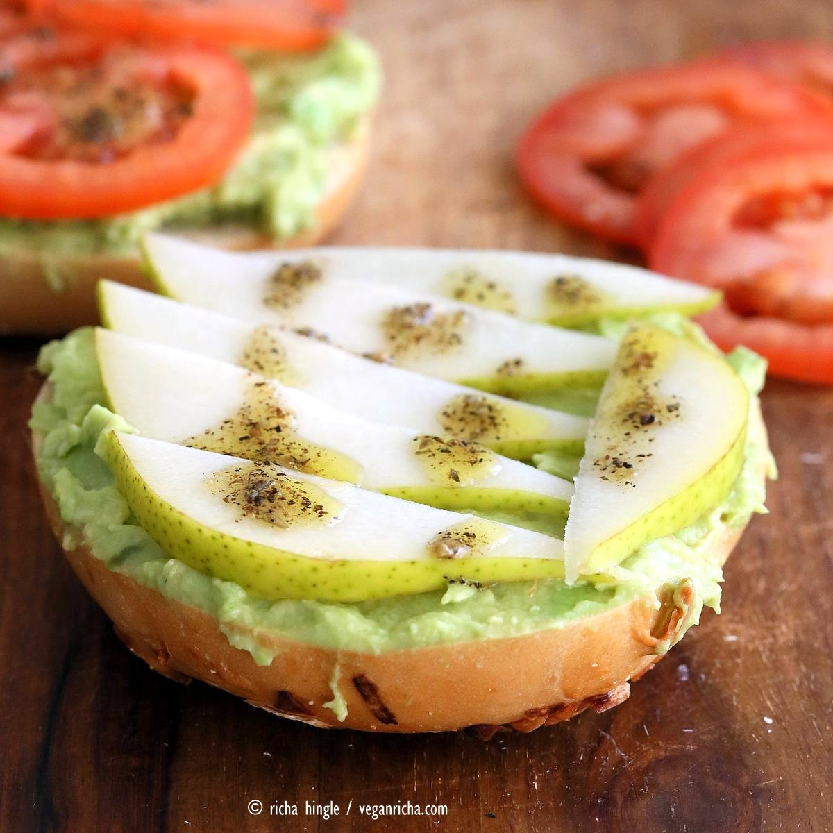Avocado Bagels with Pears and Tomatoes and Mediterranean Oregano Garlic Olive Oil Dressing Bagel Avocado Toast. Easy Vegan Snack or Breakfast. | VeganRicha.com