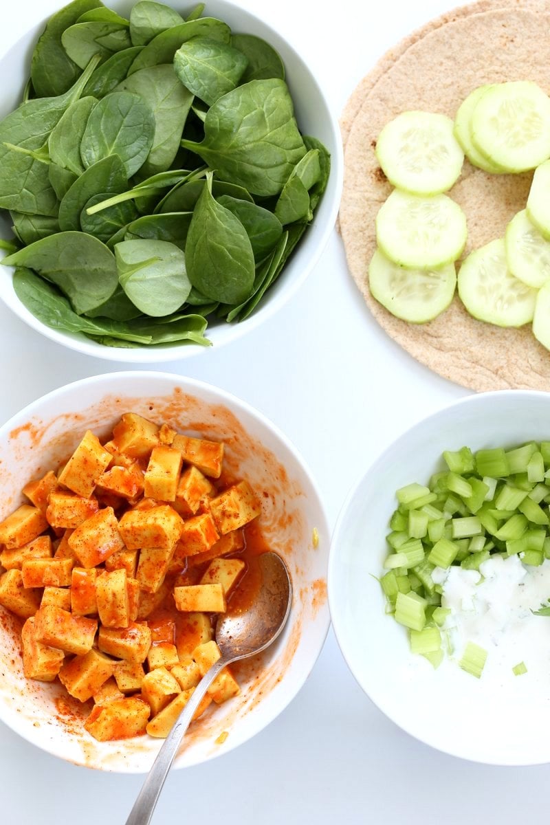 Buffalo Tofu wrap with Chickpea Tofu. Soy-free Chickpea flour Tofu tossed in buffalo hot sauce, layered with celery, spinach, cucumbers and vegan ranch. Easy weekday meal Recipe | VeganRicha.com