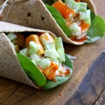 Buffalo Tofu wrap with Chickpea Tofu. Soy-free Chickpea flour Tofu tossed in buffalo hot sauce, layered with celery, spinach, cucumbers and vegan ranch. Easy weekday meal Recipe | VeganRicha.com #glutenfree #veganricha #vegan