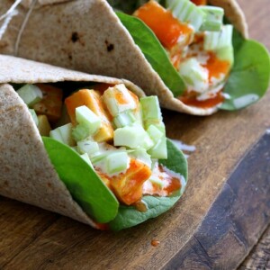 Buffalo Tofu wrap with Chickpea Tofu. Soy-free Chickpea flour Tofu tossed in buffalo hot sauce, layered with celery, spinach, cucumbers and vegan ranch. Easy weekday meal Recipe | VeganRicha.com #glutenfree #veganricha #vegan