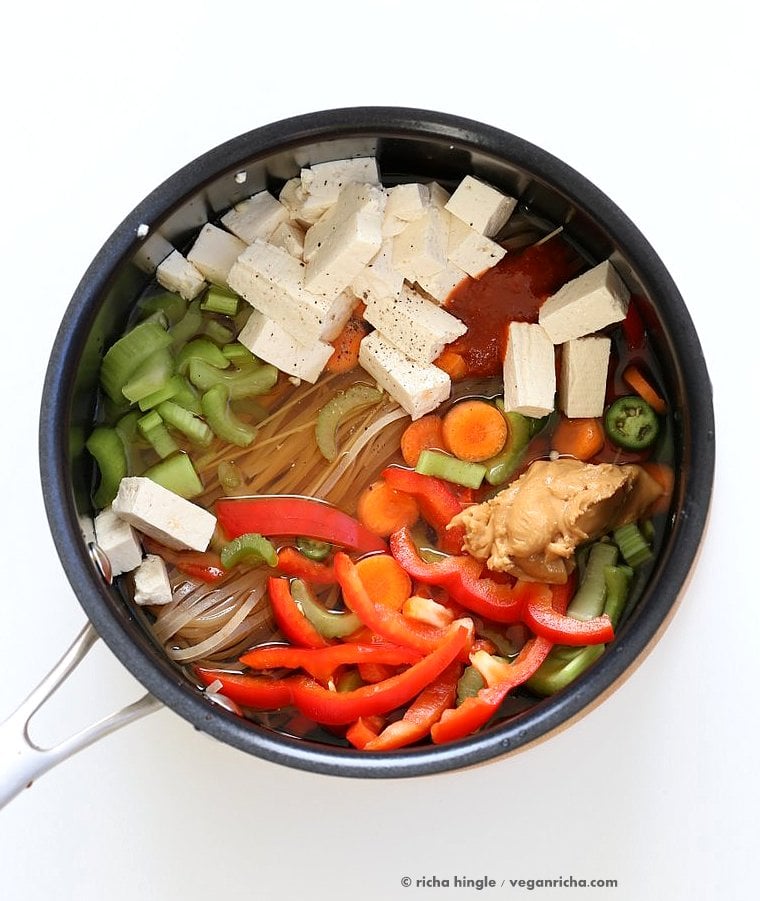 One pot peanut sauce noodles, Ready in 20 minutes! Brown Rice Noodles, Veggies, Peanut or Almond Butter, spices, flavors, boil and done. Easy Quick Weeknight Dinner Recipe | VeganRicha.com