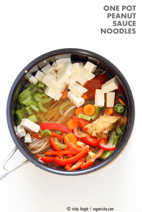 One pot peanut sauce noodles, Ready in 20 minutes! Brown Rice Noodles, Veggies, Peanut or Almond Butter, spices, flavors, boil and done. Easy Quick Weeknight Dinner Recipe | VeganRicha.com #glutenfree #veganricha #vegan