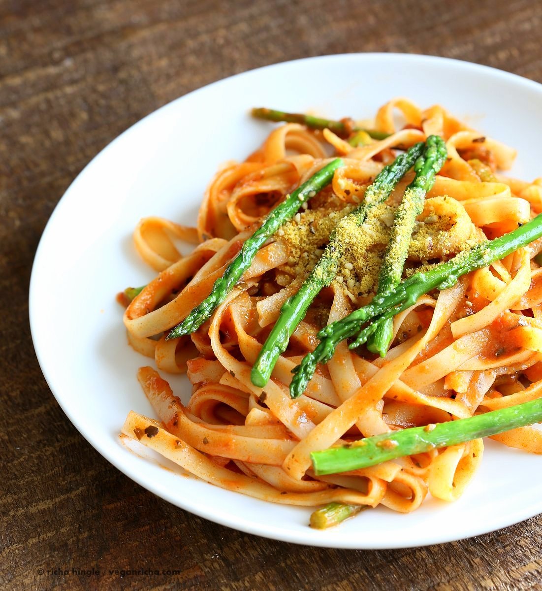 Fettuccine with Tomato Cream Sauce and Asparagus. Easy tomato Cream sauce with pasta and garlic roasted Asparagus. Use other veggies of choice. Add some chickpea chorizo or smoked coconut for variation. Vegan Soyfree Recipe. Can be gluten-free with gf pasta. | VeganRicha.com