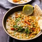 bowl of chickpea curry with toppings