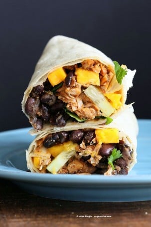 Jamaican Jerk Jackfruit Caribbean Black Bean Mango Wraps. These Burritos are packed with hot shredded jerk jackfruit, black beans, mango and cucumbers. Serve as wraps or make a sandwich or bowl. Vegan Soy-free Recipe. Can be gluten-free | VeganRicha.com