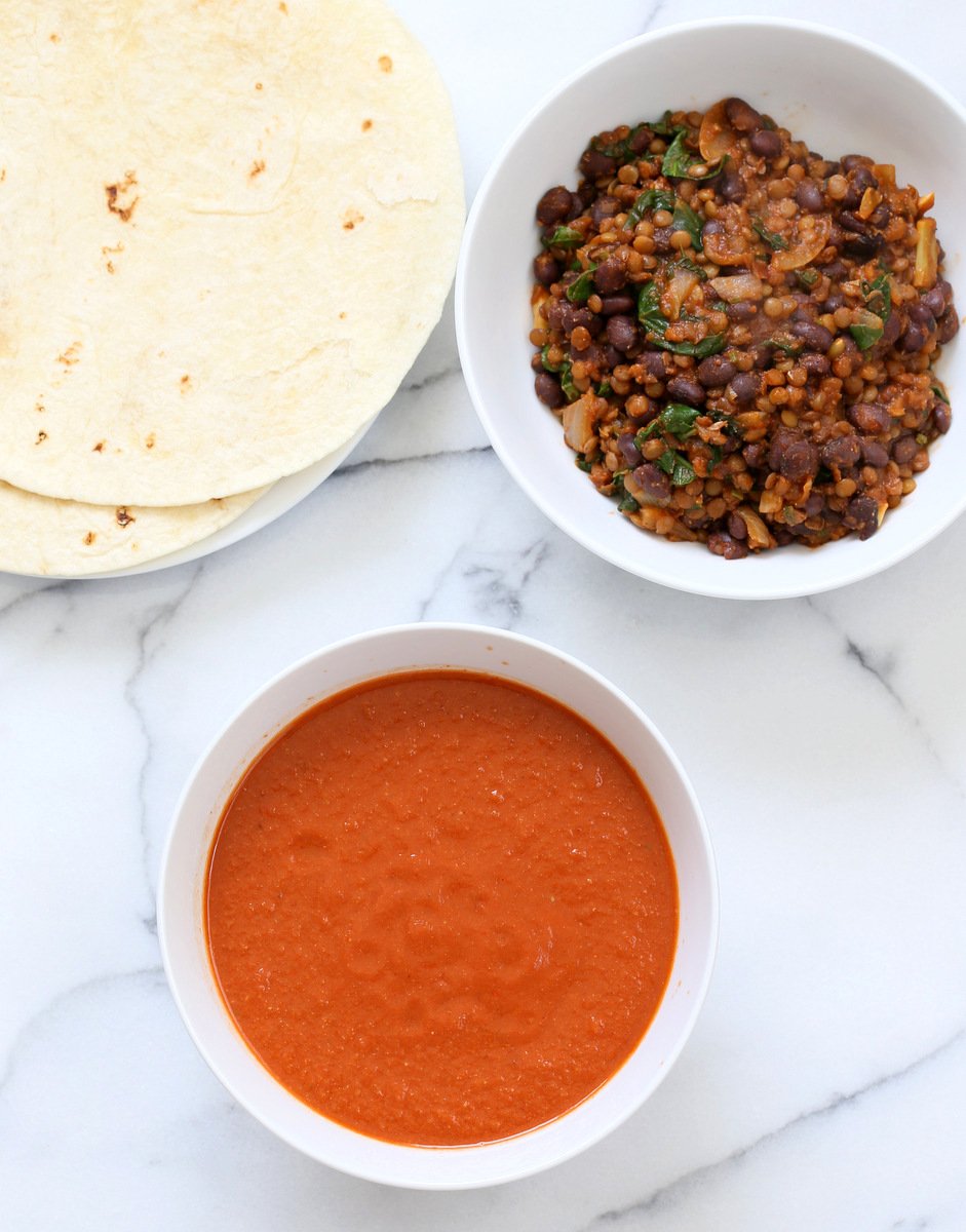 Vegan Enchiladas Recipe. Easy Enchilada Recipe with Blender Enchilada Sauce, soft tortillas filled with Black beans and Lentils. Vegan Soy-free Recipe. Can be Gluten-free. Ready within 1 Hour. | VeganRicha.com