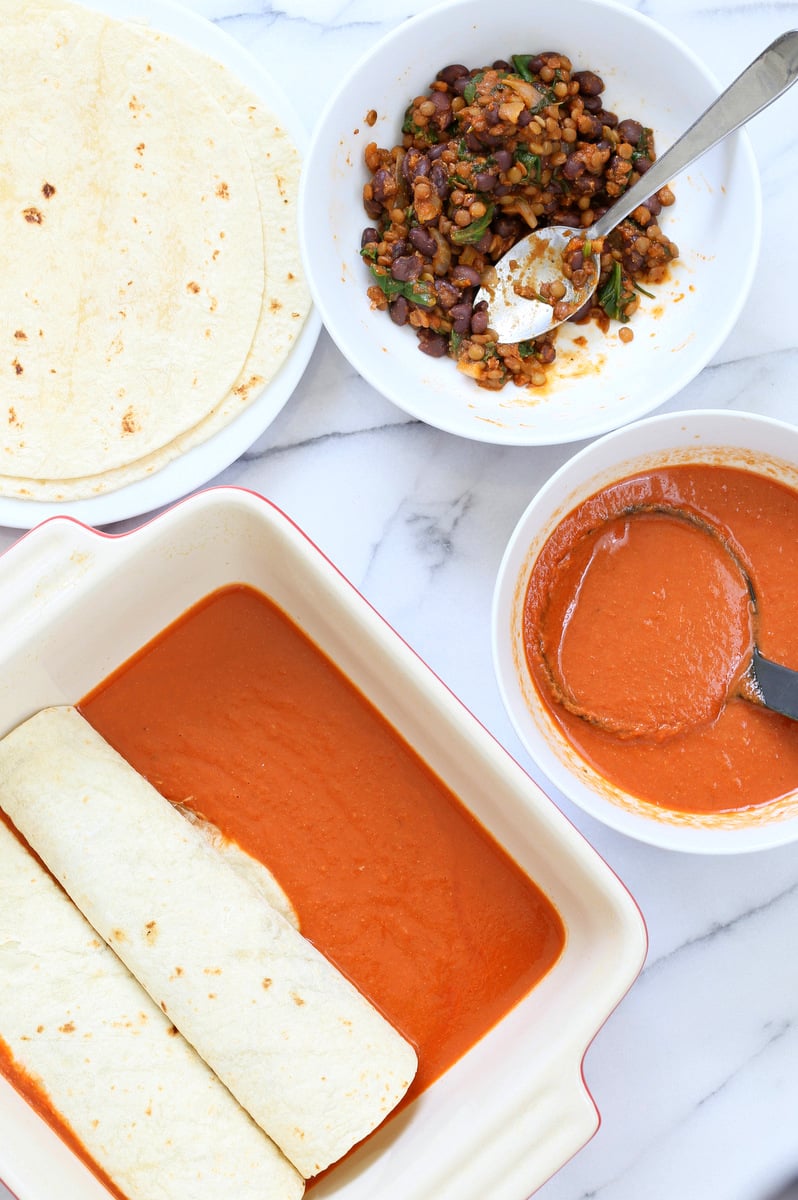 Vegan Enchiladas Recipe. Easy Enchilada Recipe with Blender Enchilada Sauce, soft tortillas filled with Black beans and Lentils. Vegan Soy-free Recipe. Can be Gluten-free. Ready within 1 Hour. | VeganRicha.com